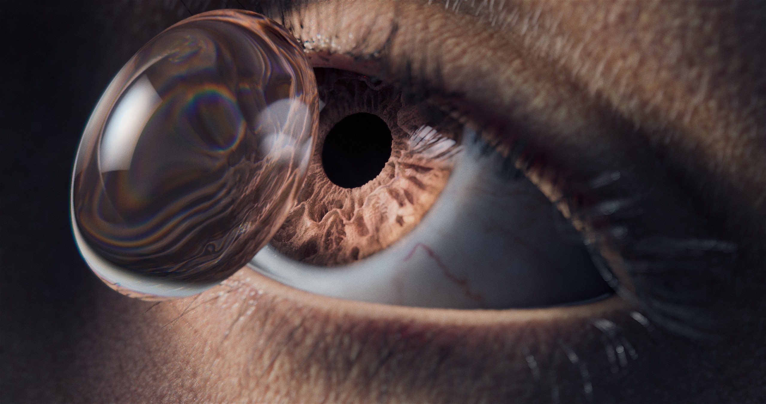 Lynthera's drug delivery conact lens being placed on eye as 3D animation.jpg